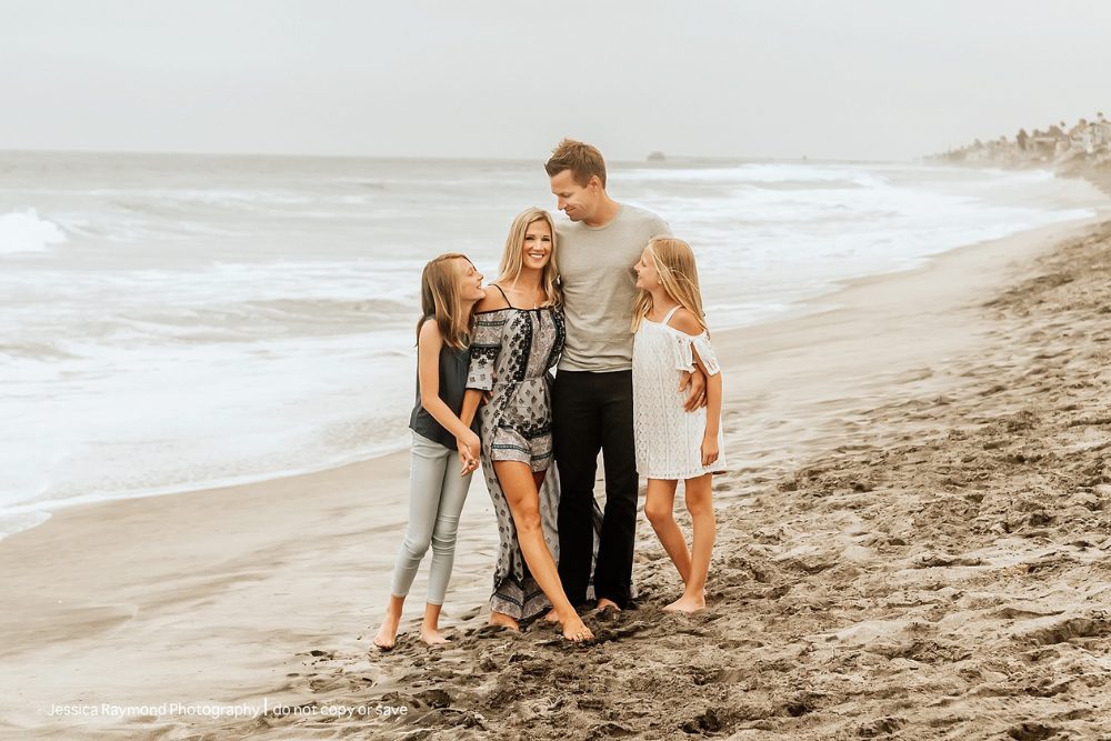 Families enjoying a sunny day at the beach in Carlsbad, California