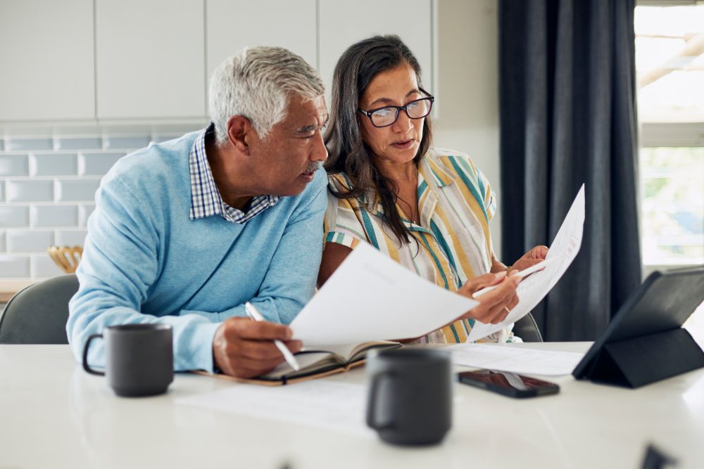Home buyers reviewing mortgage options with a lender in North San Diego County