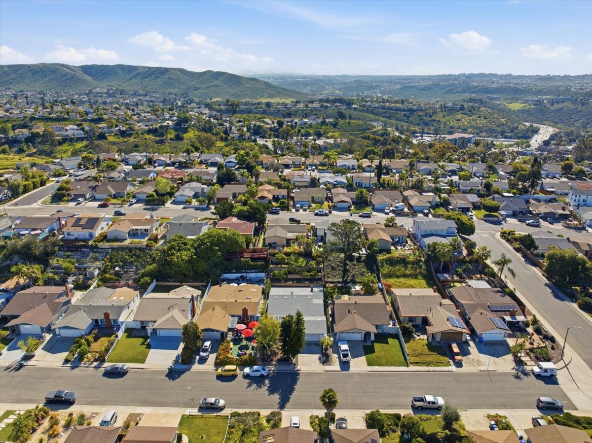 Aerial view of Rancho Peñasquitos neighborhood showing established homes, nearby amenities, and surrounding hills in North County San Diego