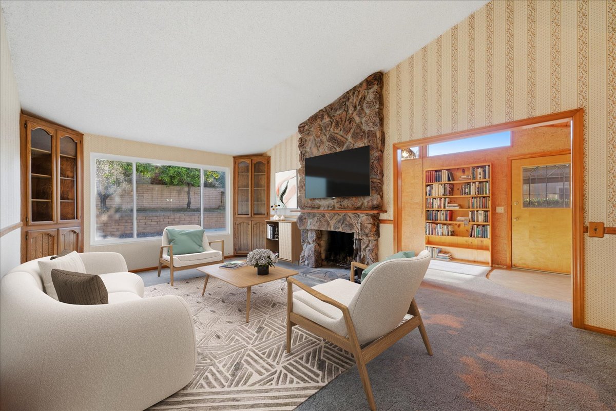 Bright living room with fireplace and open layout in Rancho Peñasquitos single-story home