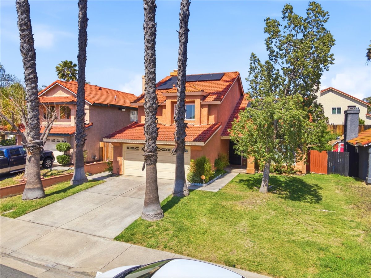 Front exterior of 24570 New Haven Drive in Murrieta featuring updated curb appeal and a spacious front yard